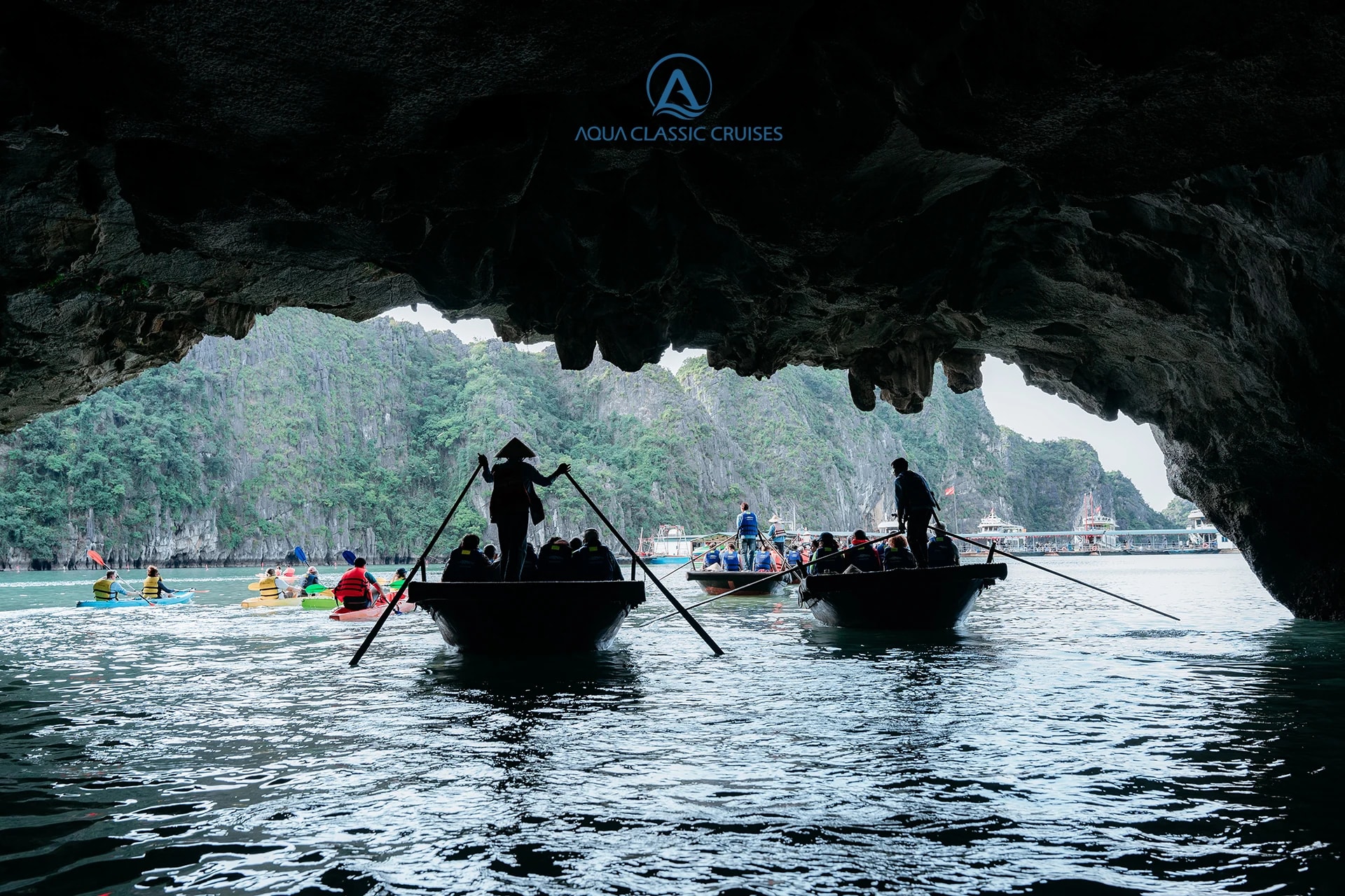 Rowed bamboo boat entering Luon Cave, Ha Long Bay