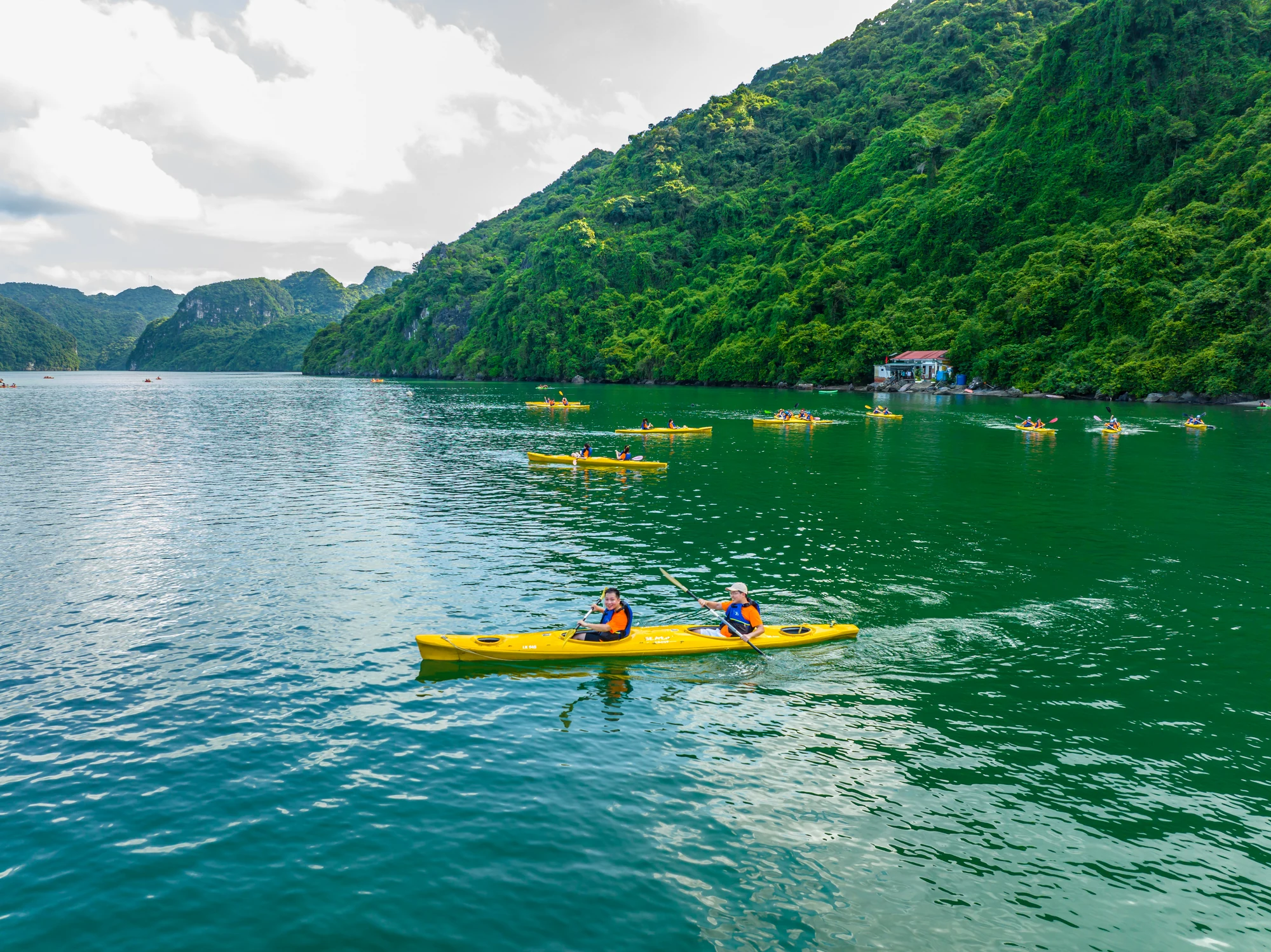 Guests kayaking in Lan Ha Bay