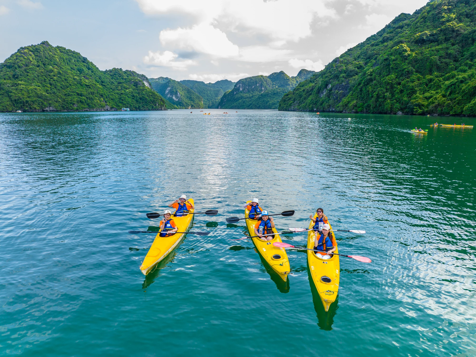 Guests kayaking in Lan Ha Bay