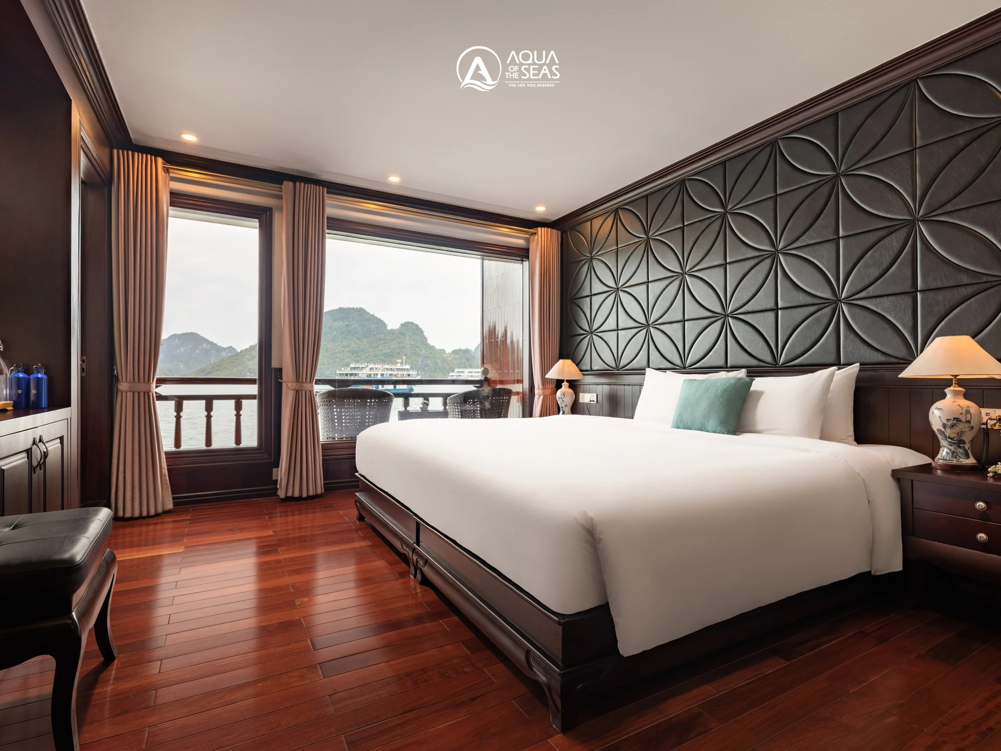 Senior Suite Balcony cabin with a double bed and bay-view windows on Aqua Of The Seas Cruise