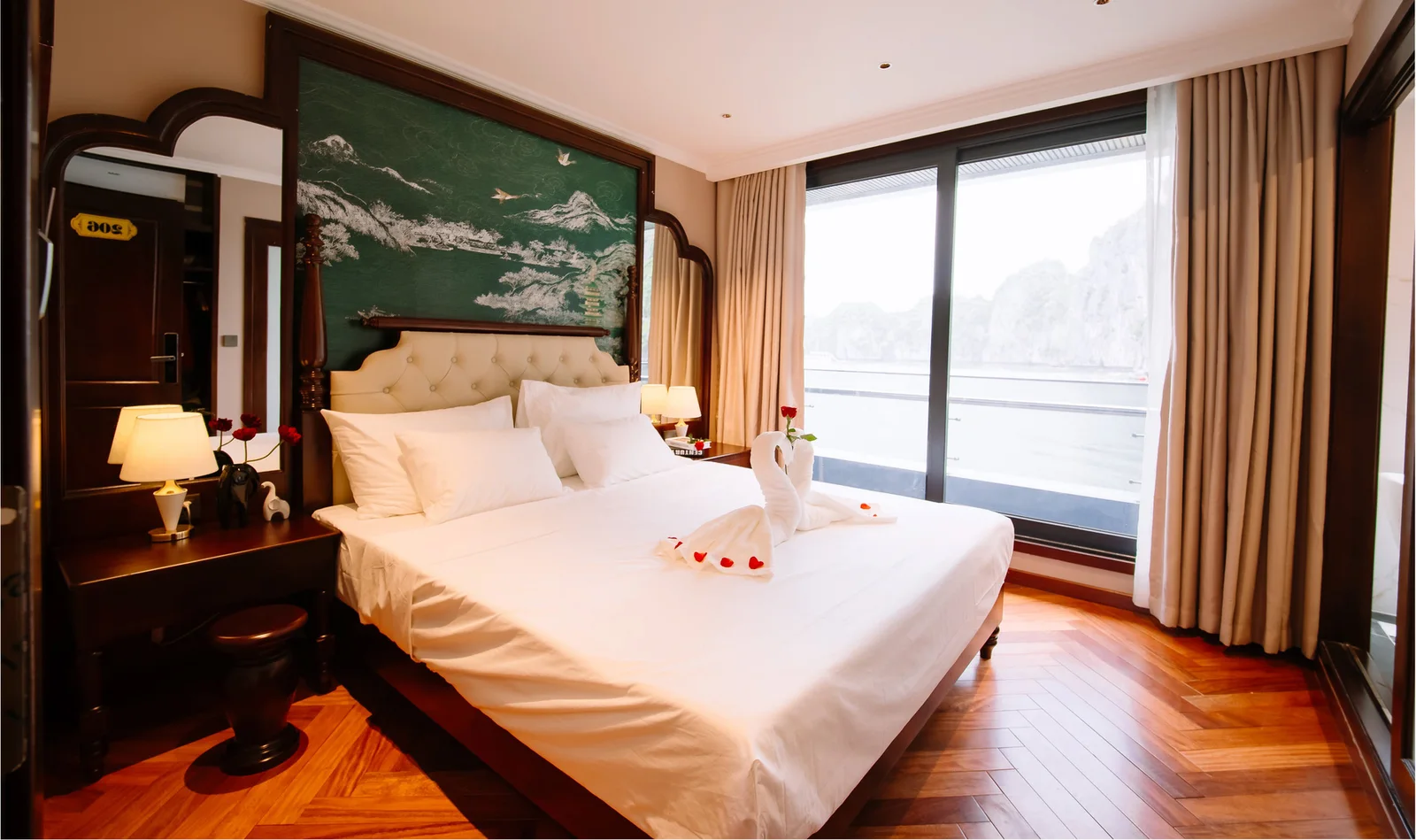 Deluxe Double Cabin with a double bed, a large window and a private balcony