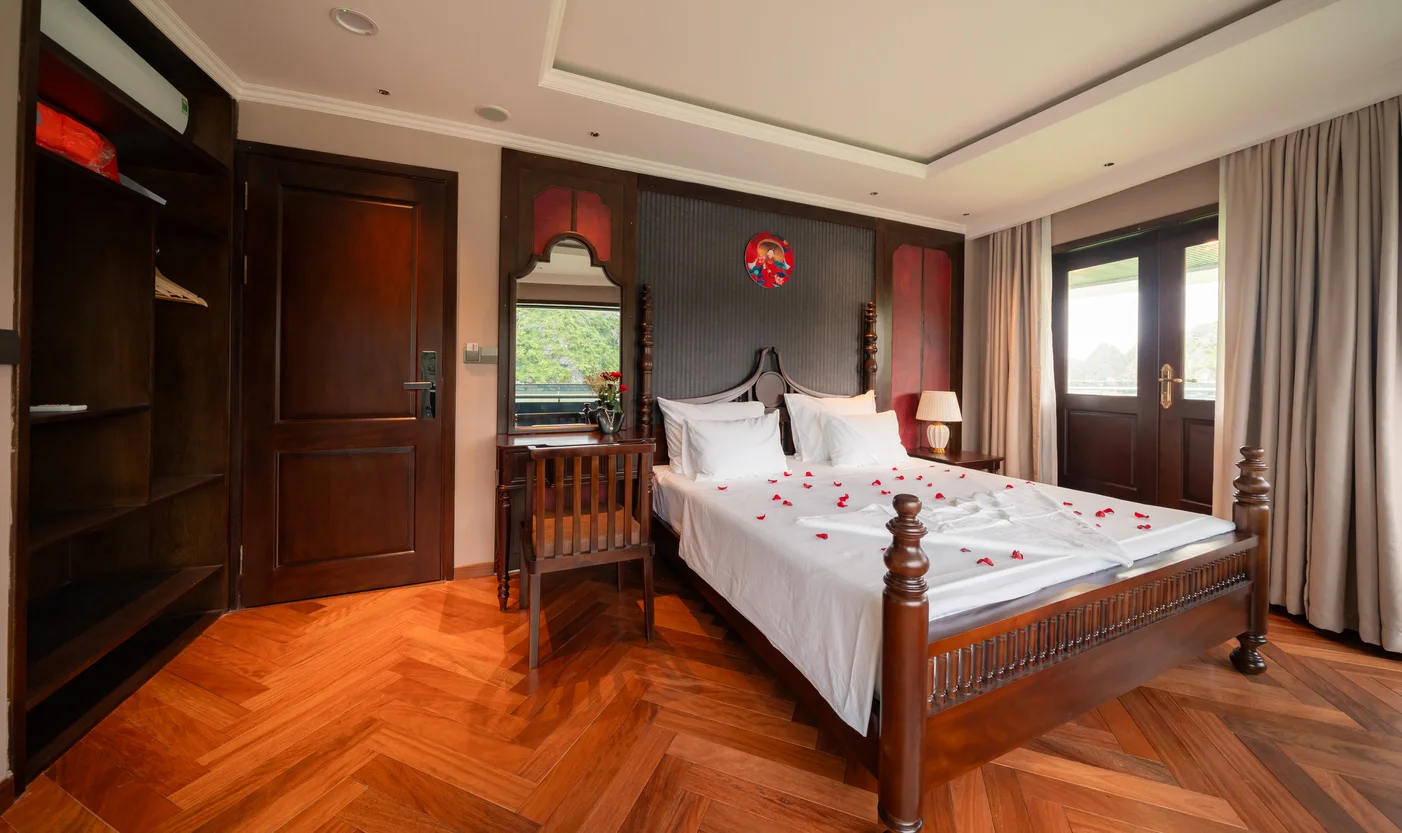 VIP Cabin at the bow with a double bed and dark wood panelling